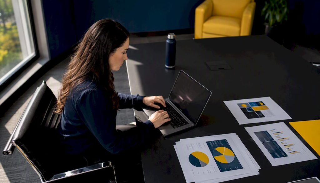 Focused cybersecurity analyst working in SOC room