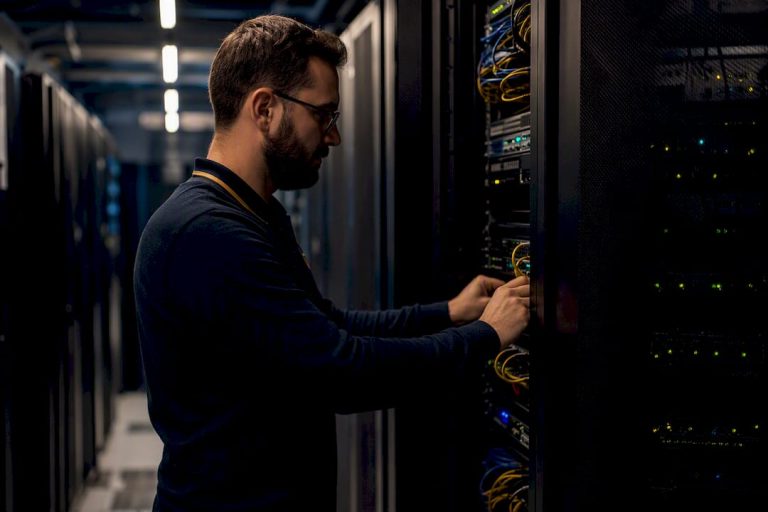 Technician monitoring network hardware