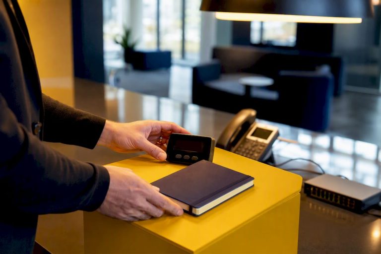 Hands arranging timer on a conference table