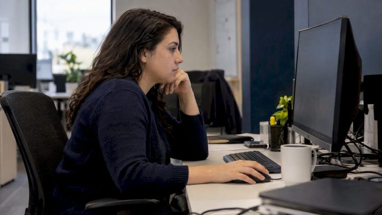 Analyst reviewing cloud spending at work